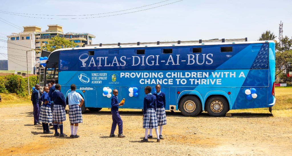 Students gathered around the Digi AI Bus at launch