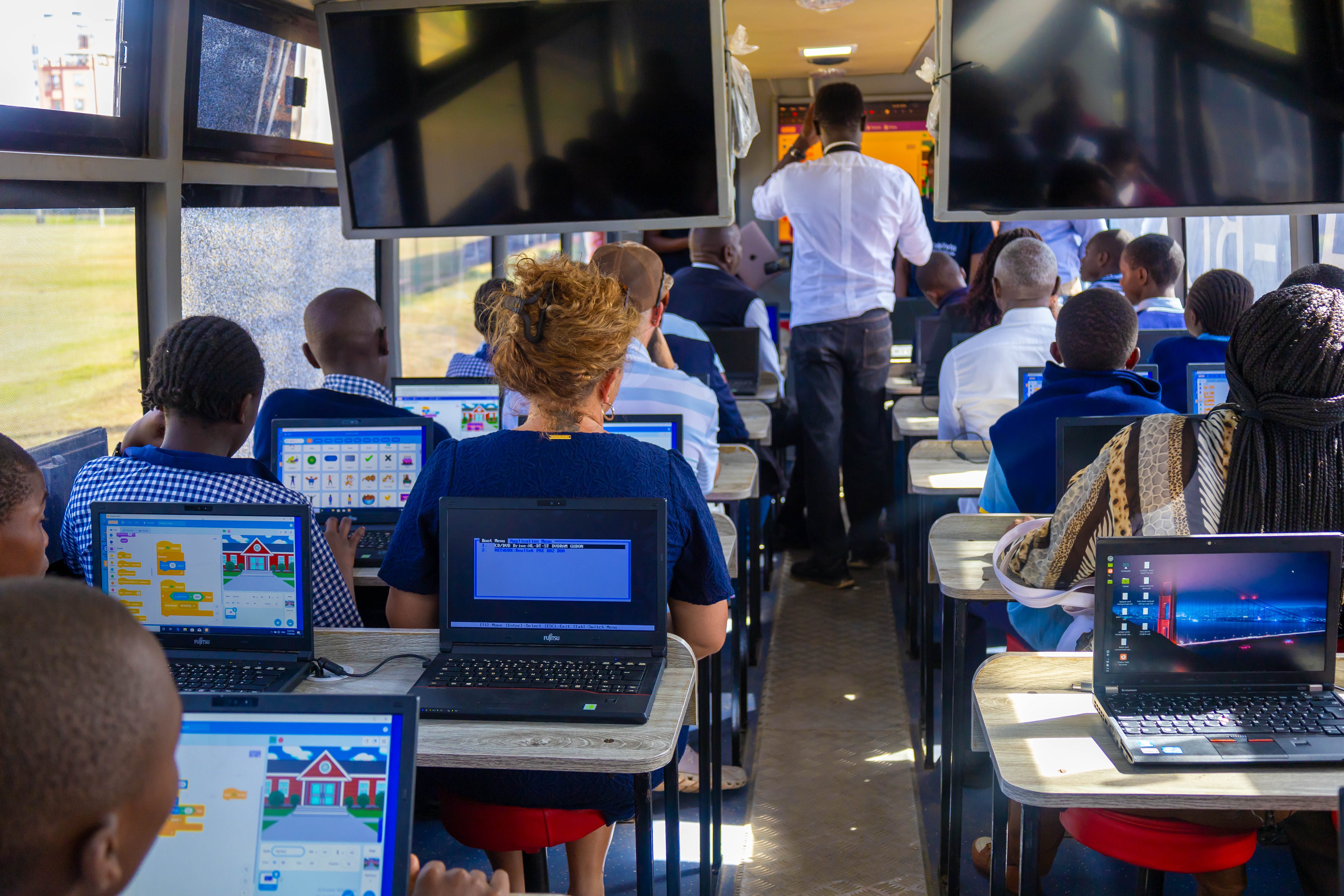 Participants coding during the Digi AI Bus workshop