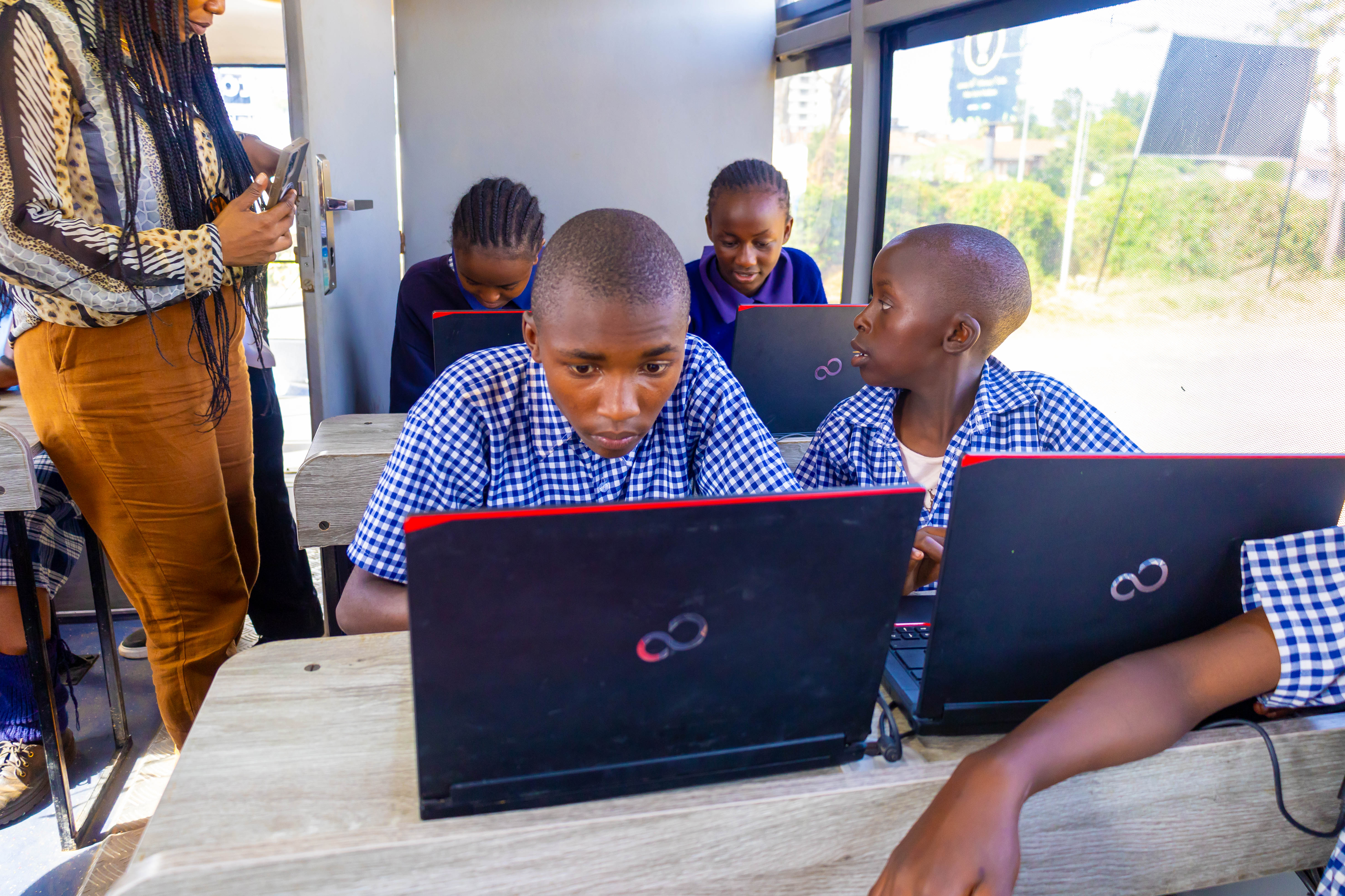 Students engaged in a Digi AI Bus session