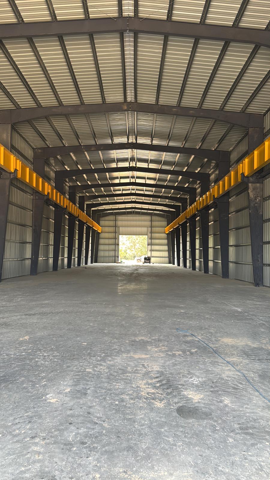 SNAP Buildings — interior of a completed commercial warehouse with crane rails