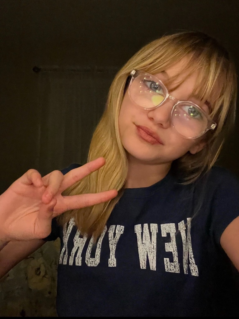 Autumn giving a peace sign
