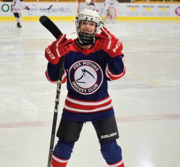 Natalia Moore on the ice in Fox Motors jersey