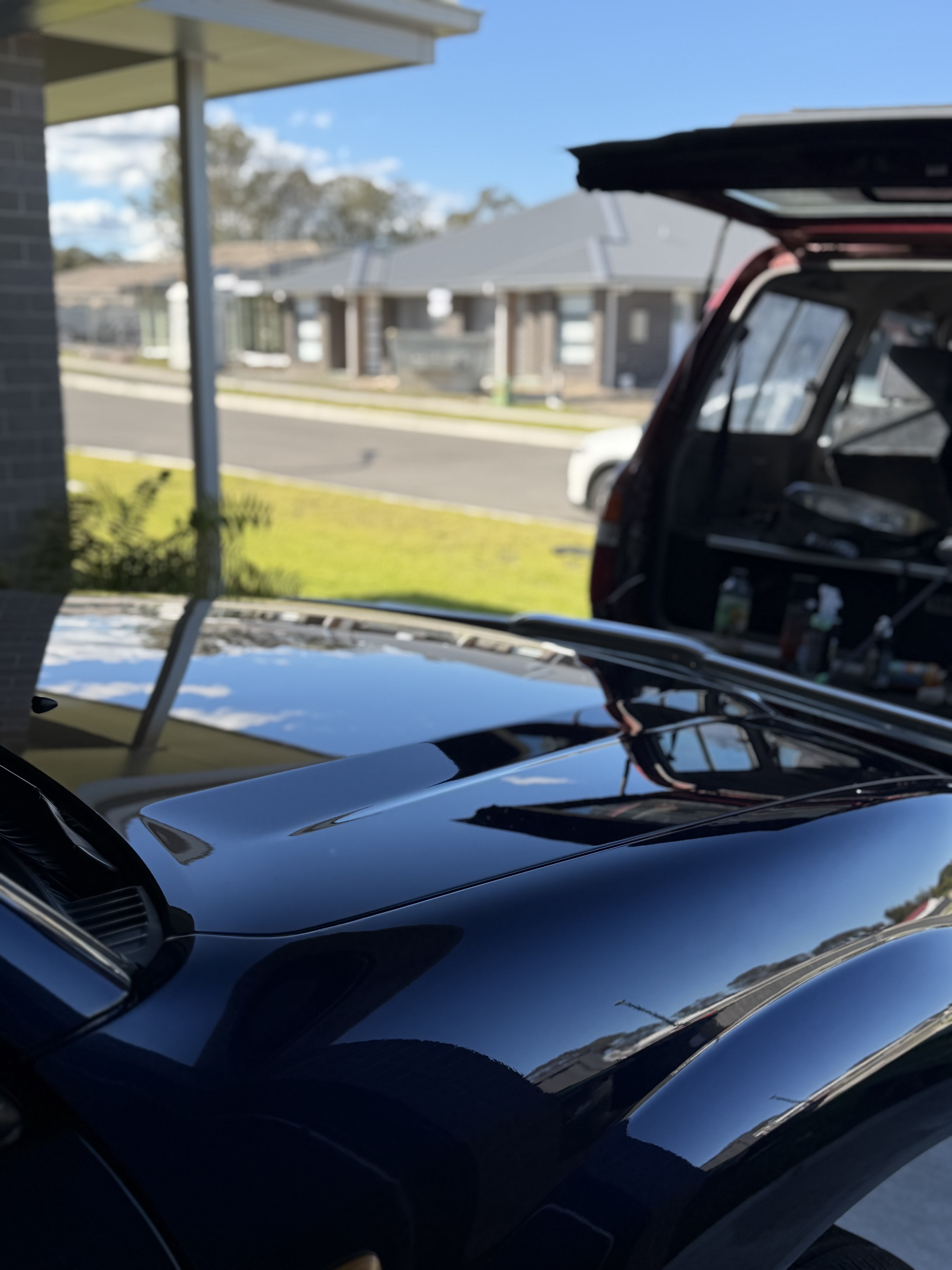 Freshly polished car paint by Eclipse Customs Auto