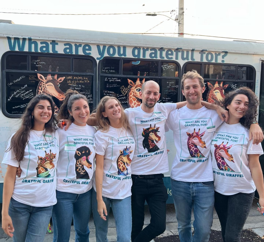 The Grateful Giraffes bus with the question What are you grateful for?