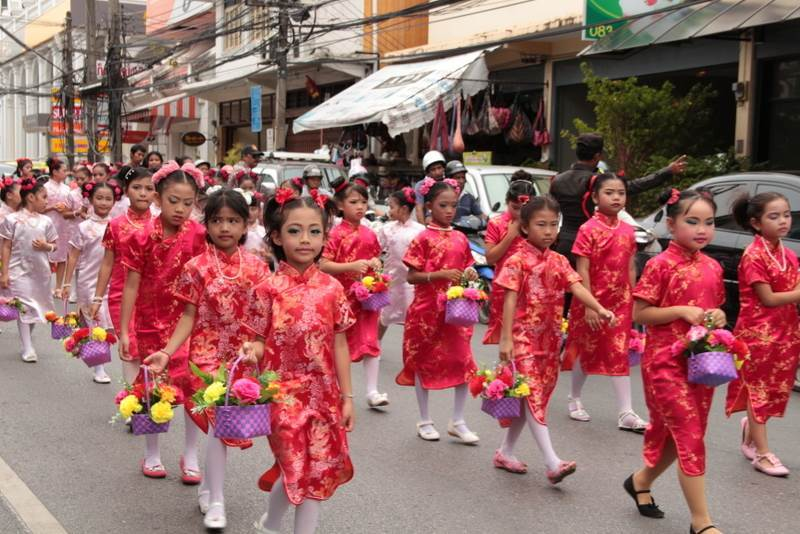 Children in traditional outfits at the Por Tor parade in Phuket Town