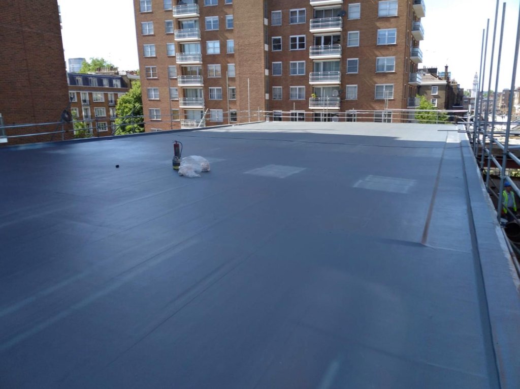 Central London flat roof — completed seamless polyurea waterproofing, residential backdrop