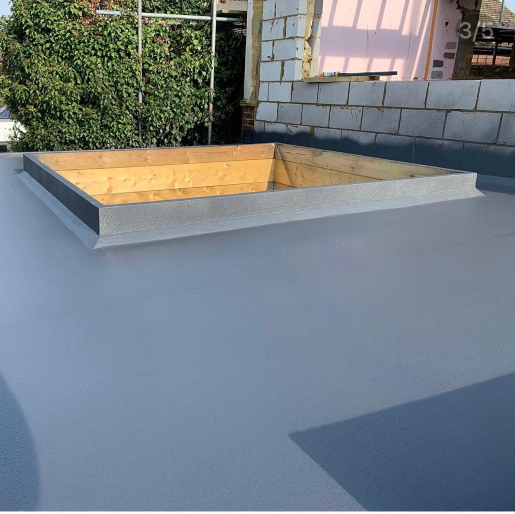 Rooflight kerb detail — HotSpray polyurea membrane continuous from deck surface to kerb upstand, no joints
