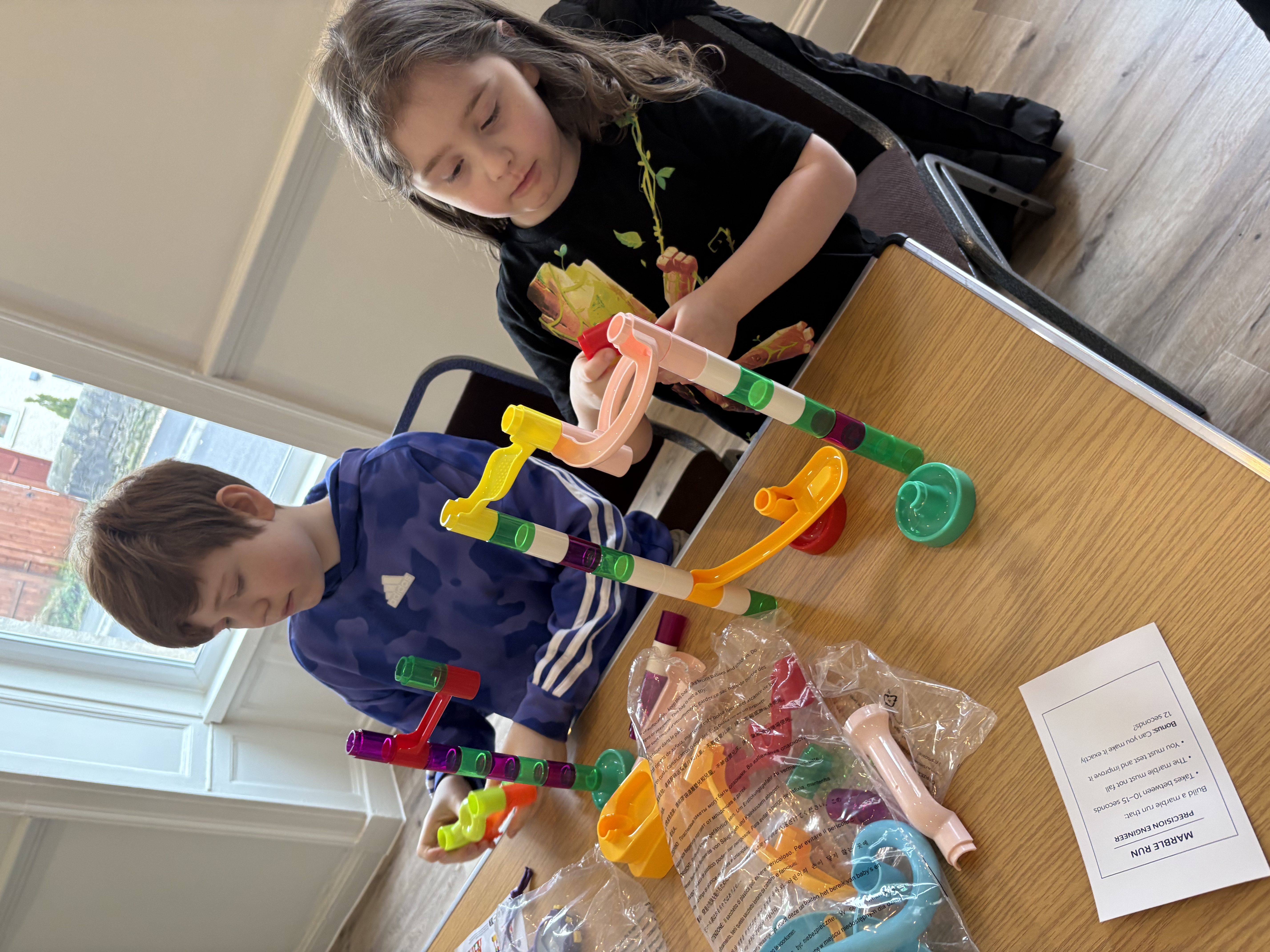 Children building a marble run