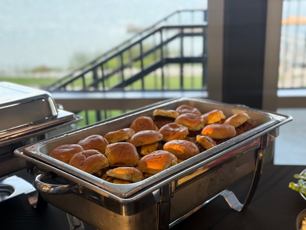 Golden mini sliders with melted cheese, ready to serve