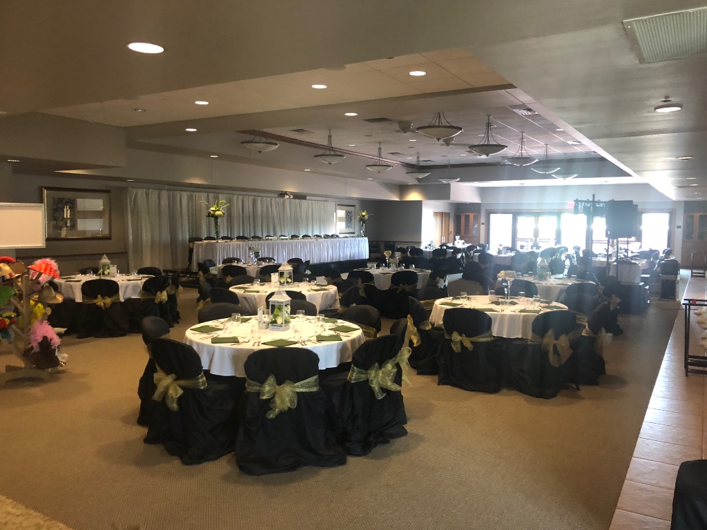 Full reception hall setup with elegant table settings and white lantern centerpieces