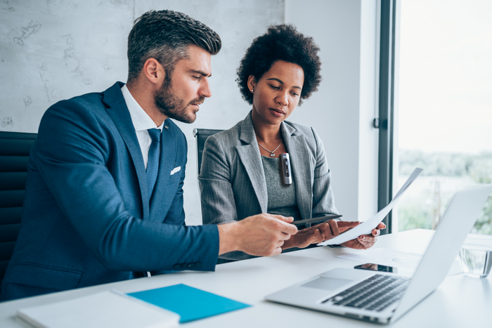 Legal professionals working in office