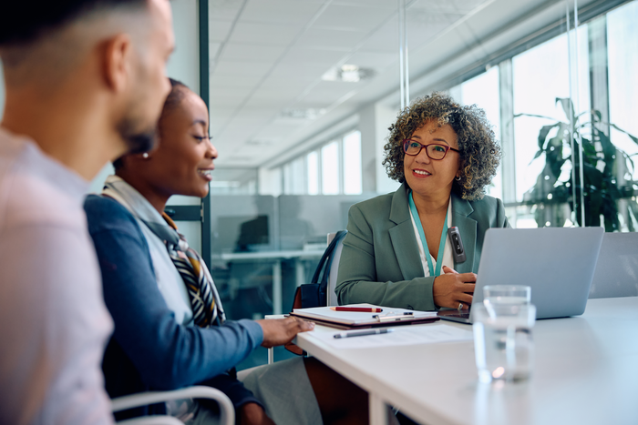 Financial advisor consulting with clients