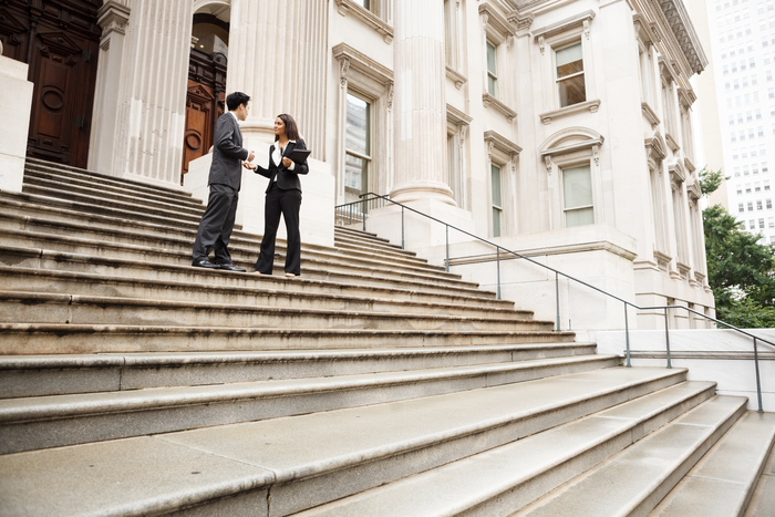 Attorneys in discussion outside courthouse