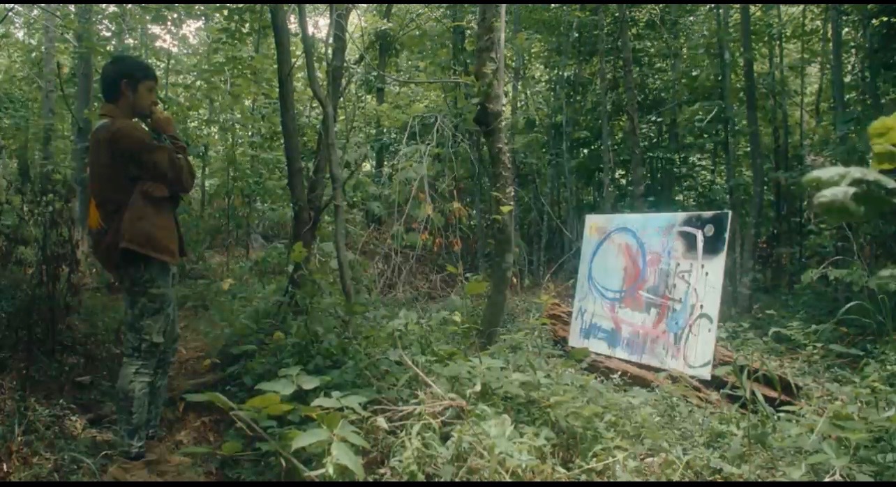 Kenny at Shope Creek with painting in the woods