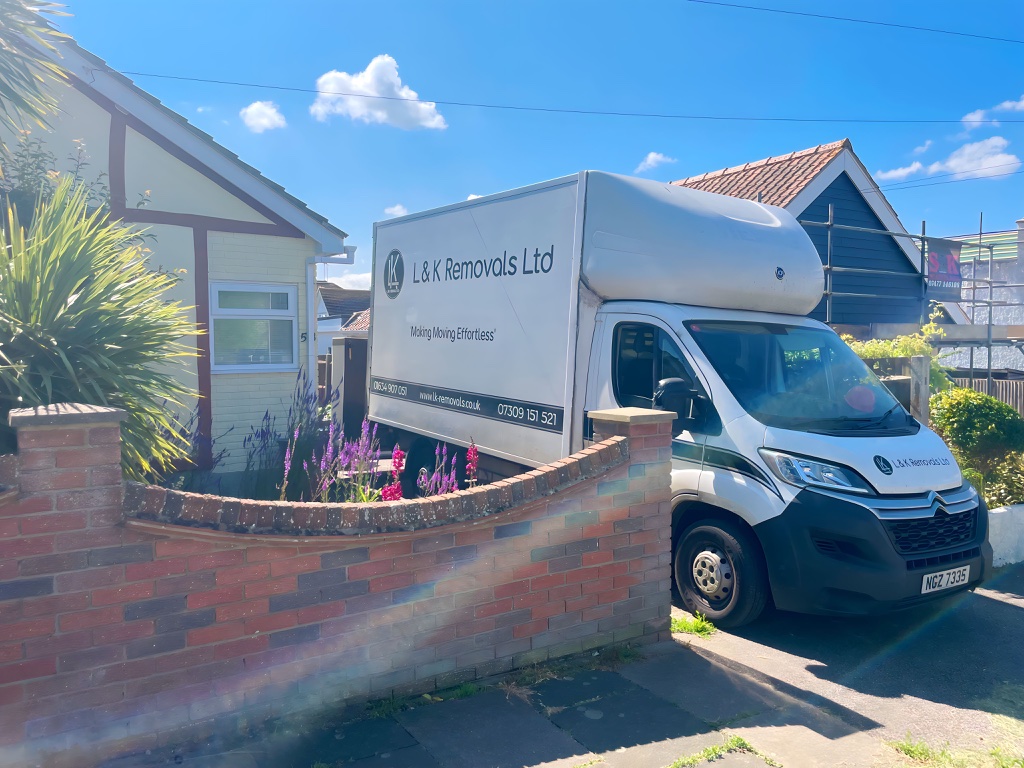 L&K Removals team loading boxes at bungalow in Kent