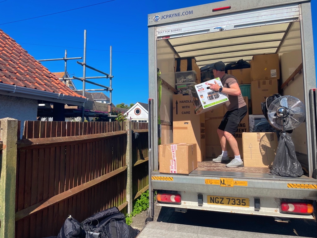 L&K Removals team unloading boxes from removal truck