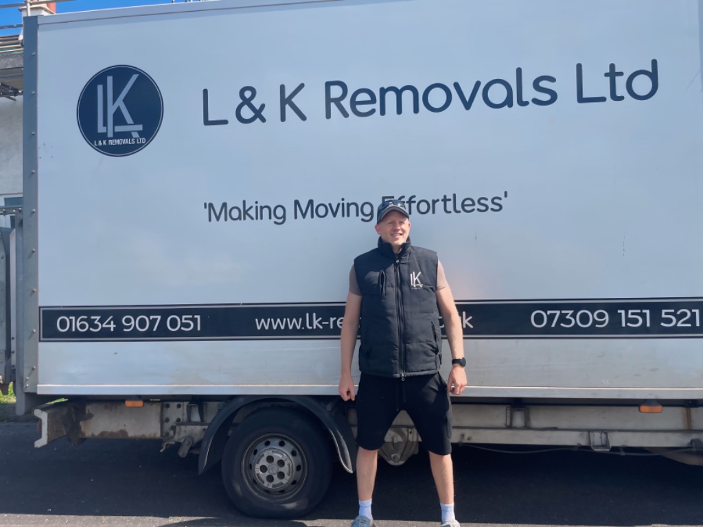 L&K Removals team member beside branded removal truck