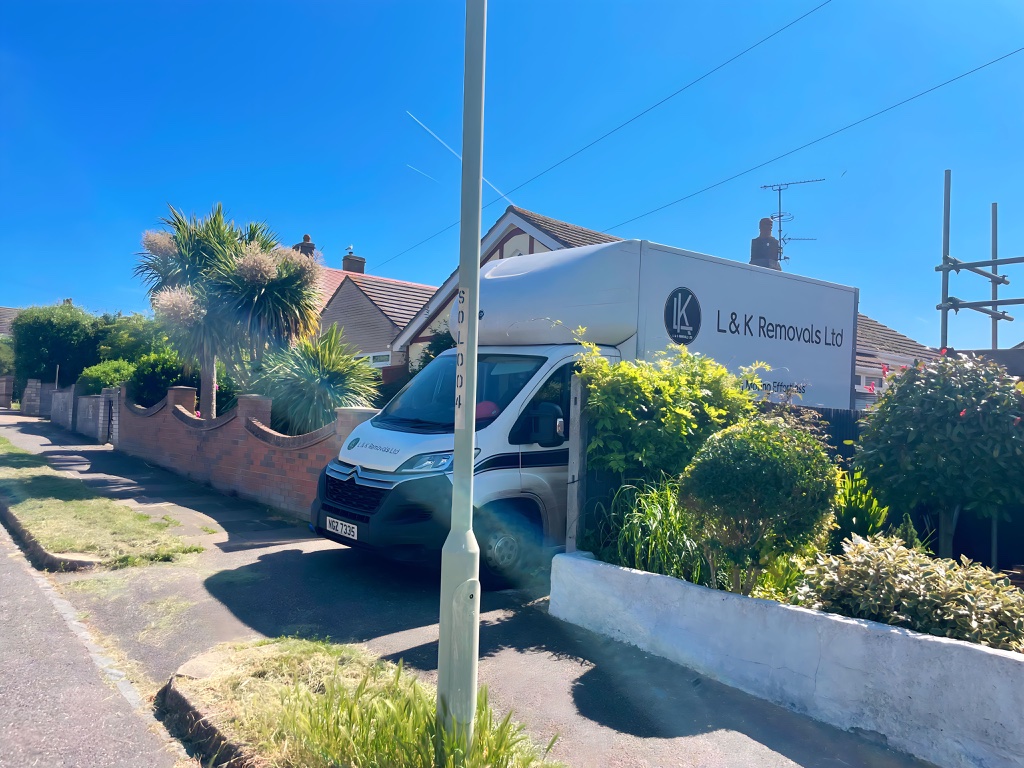 L&K Removals branded van parked outside Kent property