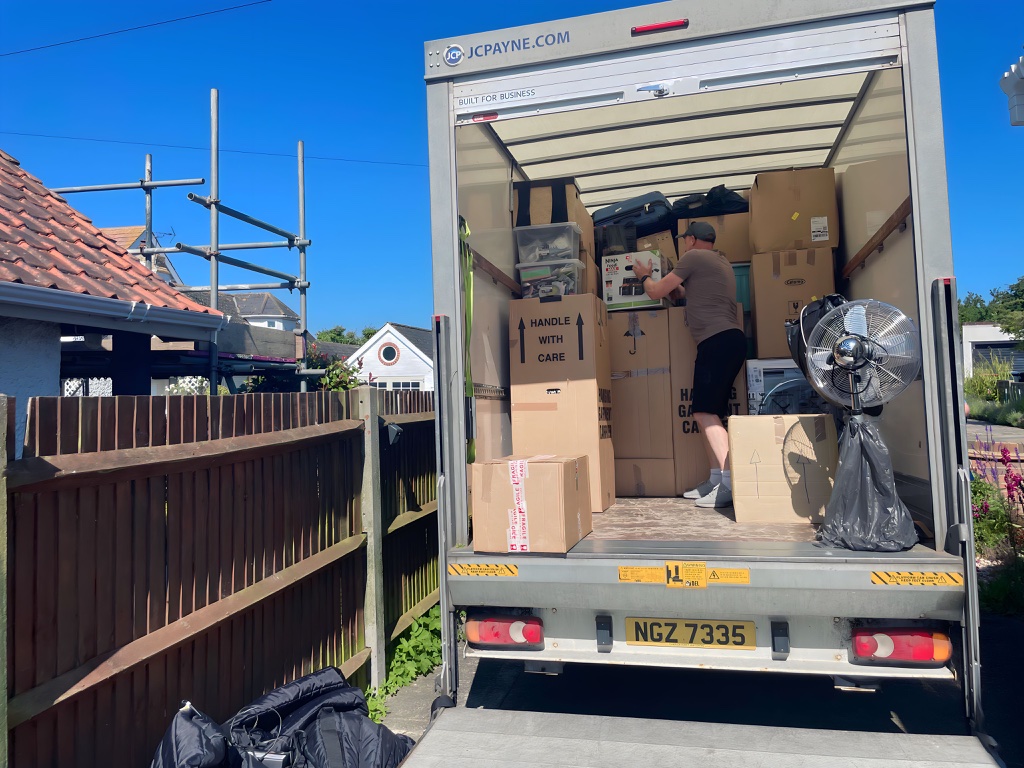 L&K Removals team loading removal truck with boxes