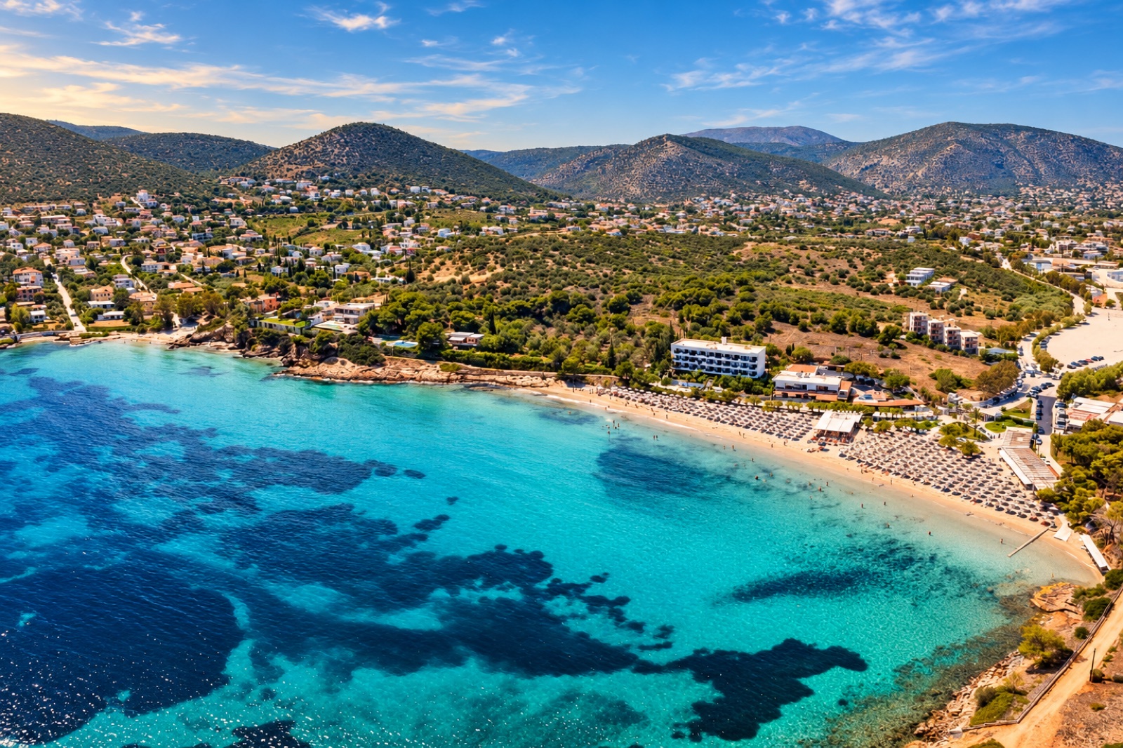 Aerial view of Avlaki beach and its turquoise bay in Porto Rafti, Greece — near Chiki Cassa Porto Rafti apartment