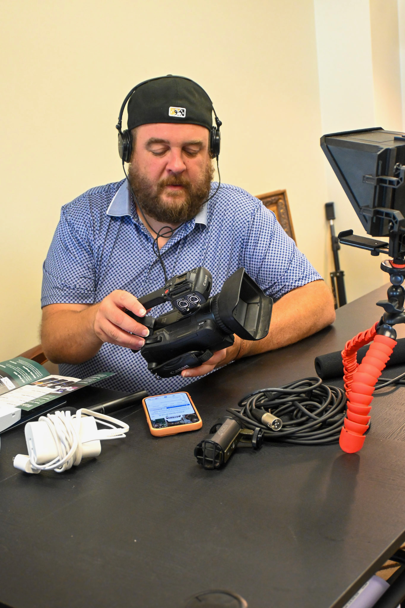 Astoria Media Group team member operating video production equipment