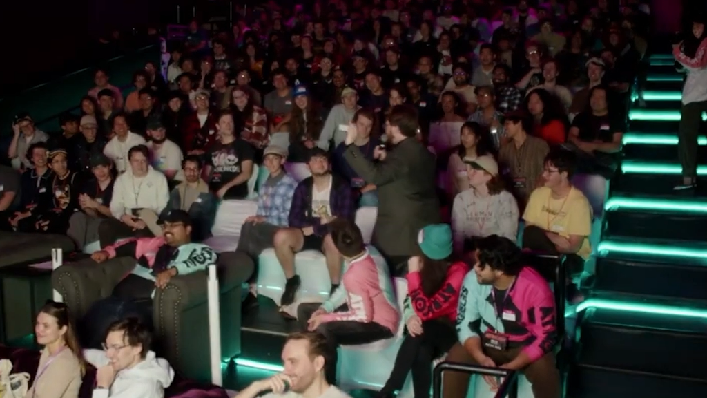 A packed theater audience attending a Braden Carlisle performance