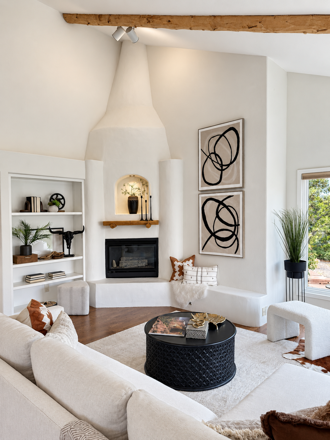 Living room with corner windows framing red rock views at 10276 Totem Run — Roxborough Littleton CO home