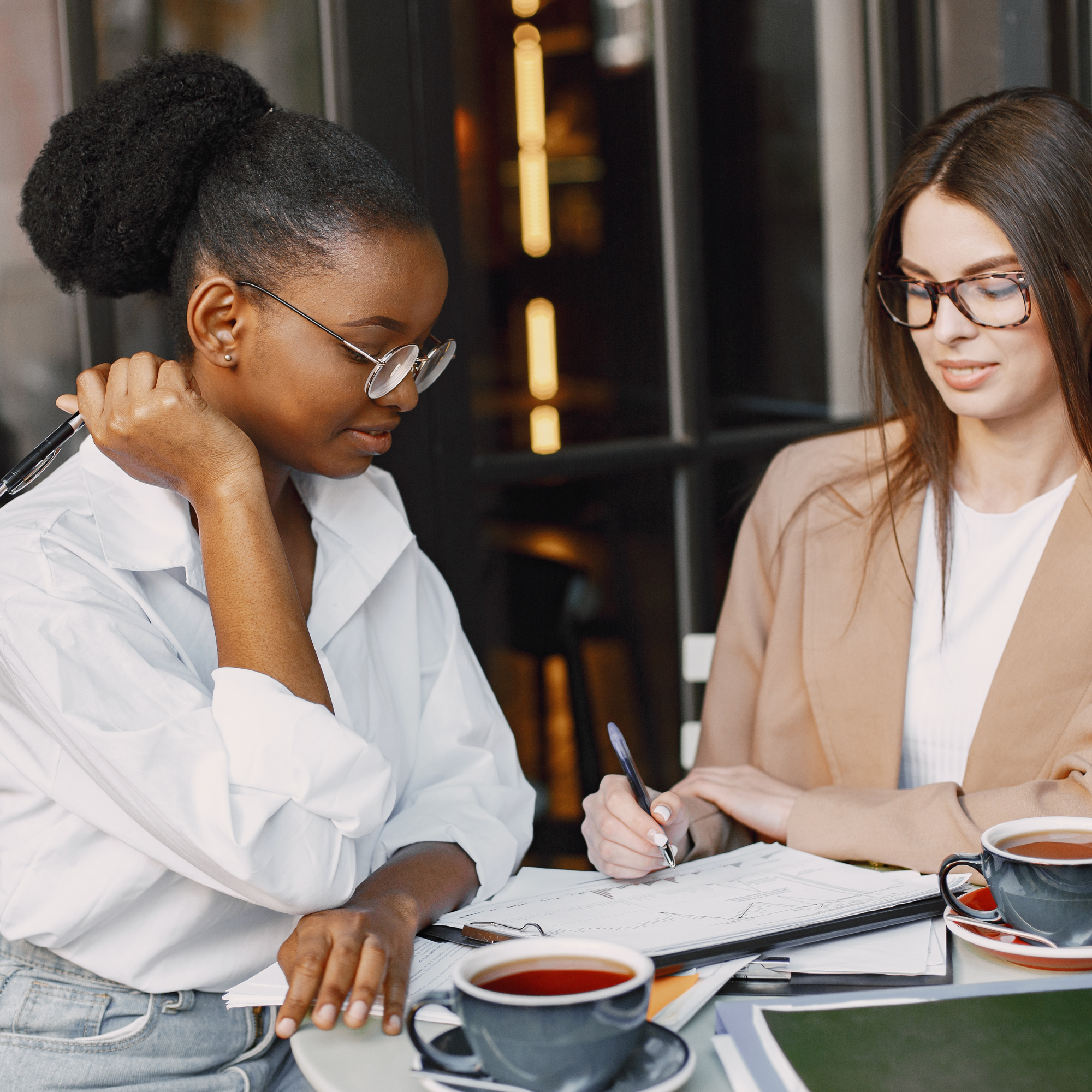 Two colleagues reviewing applications together