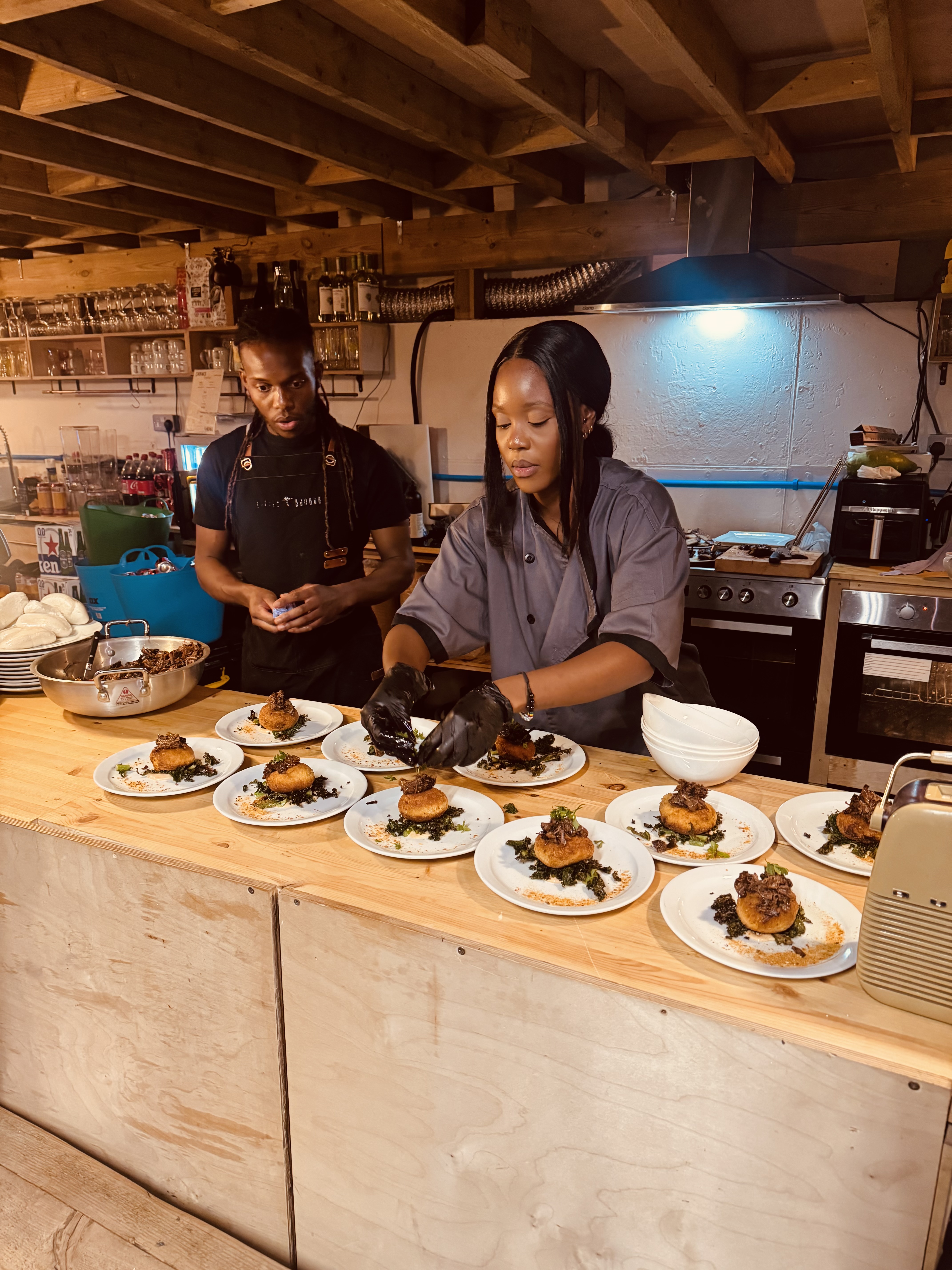 Plating the butternut rice cakes with braised beef and greens