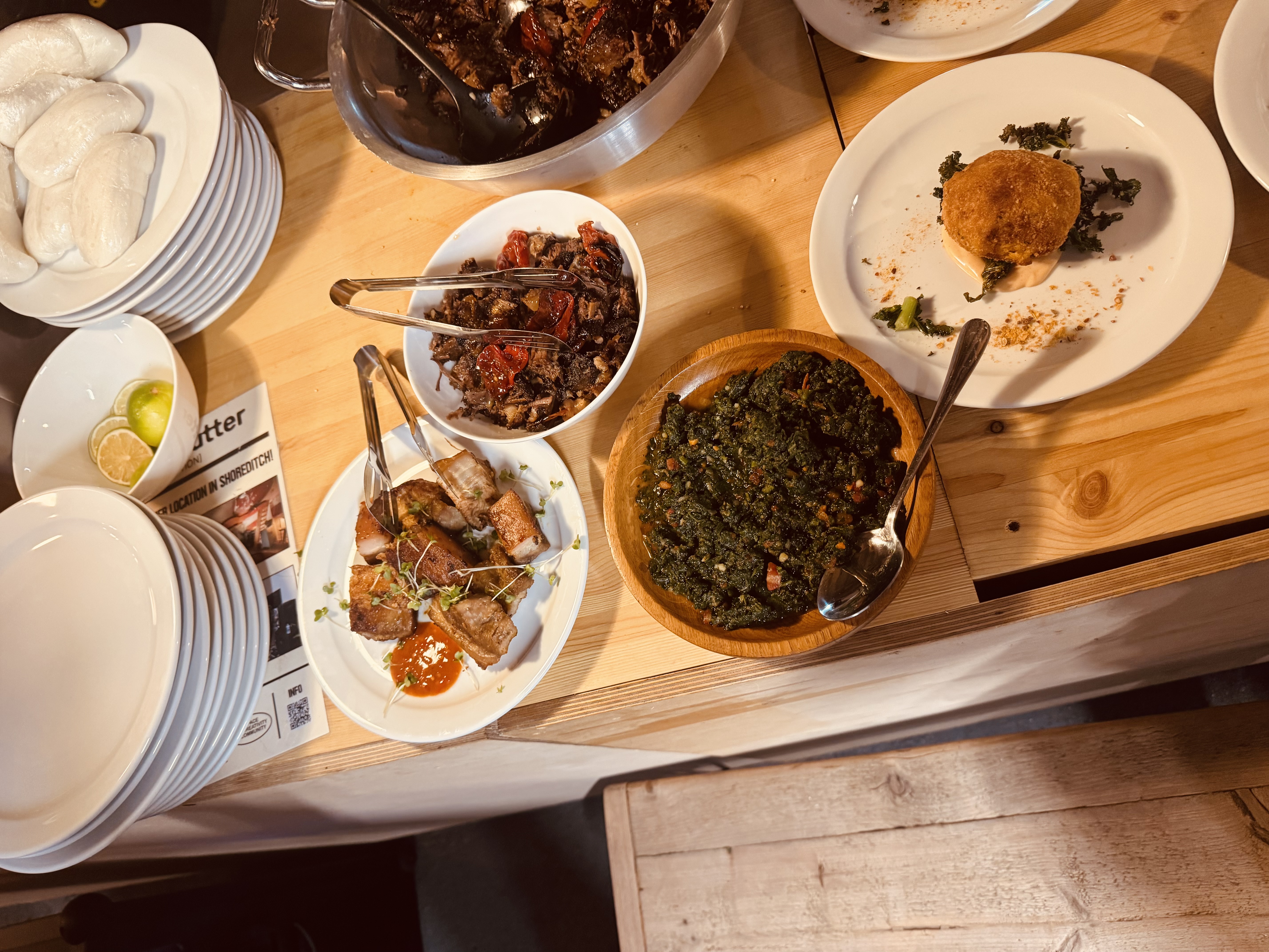 The harvest table — slow-braised beef short rib, sautéed greens (muboora) and pork belly