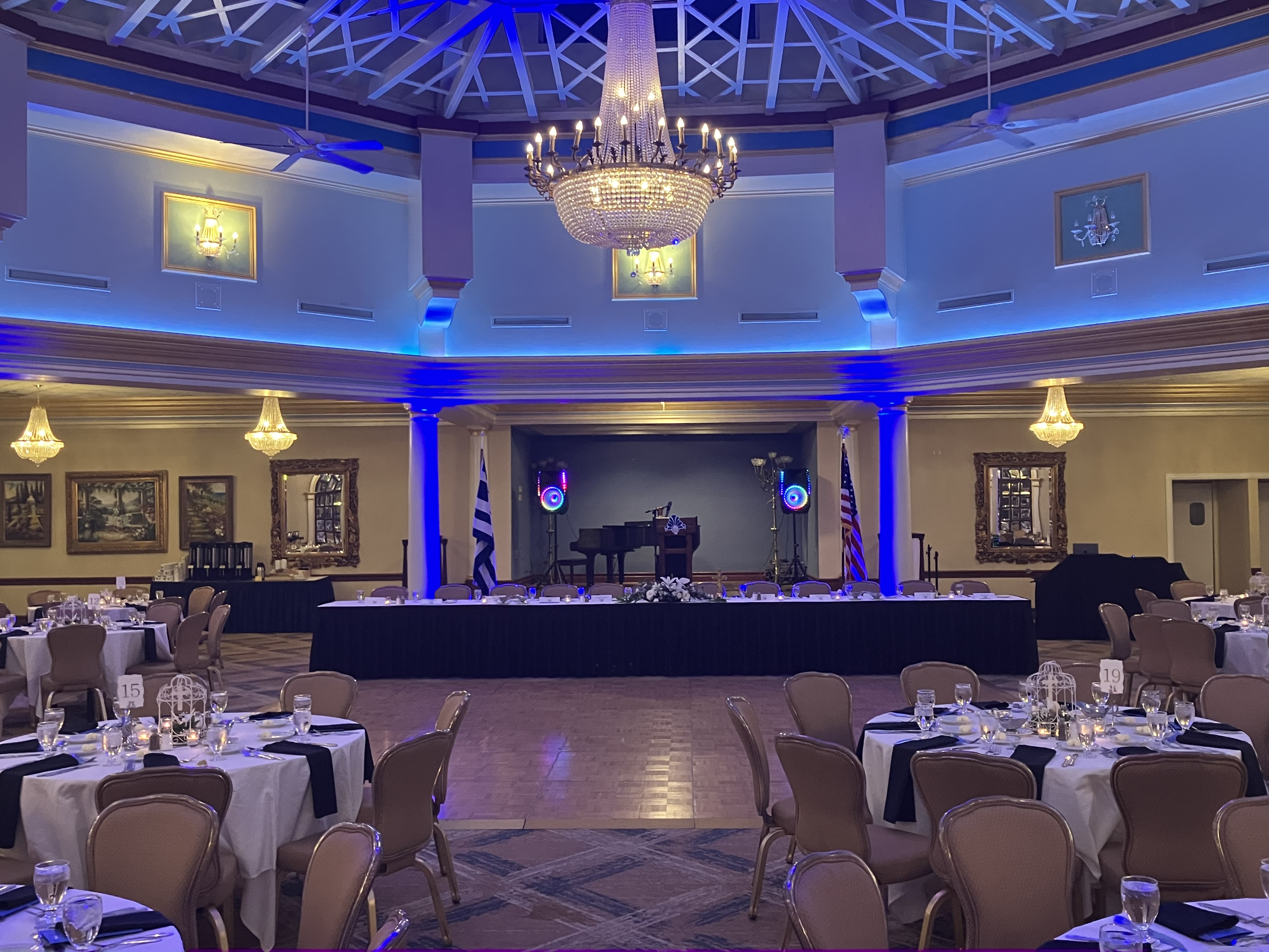 Elegant ballroom event with guests at round tables