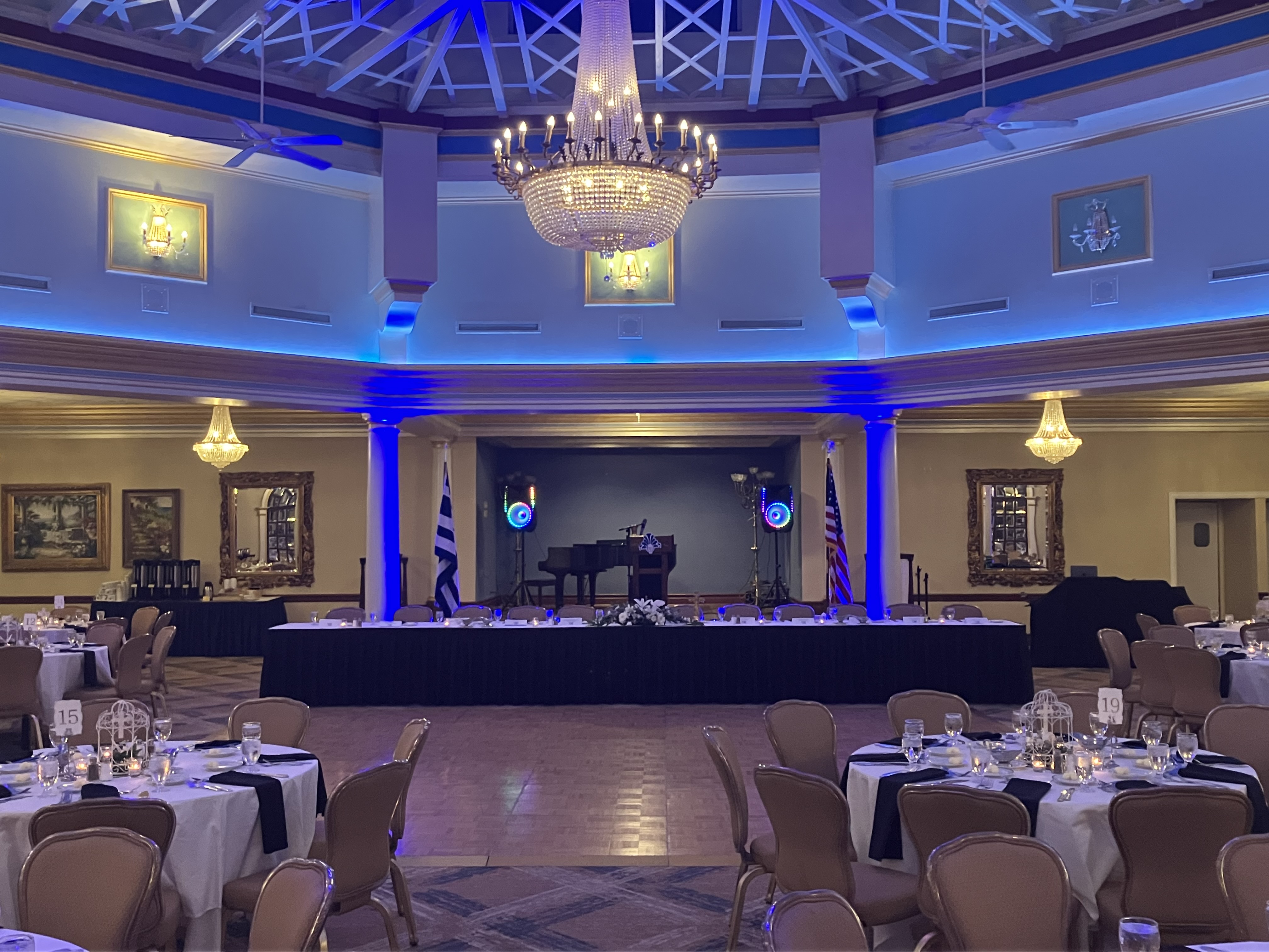 Grand ballroom with dance floor and stage lighting