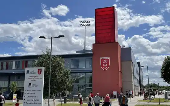 Supporters arriving at a rugby league stadium entrance on match day