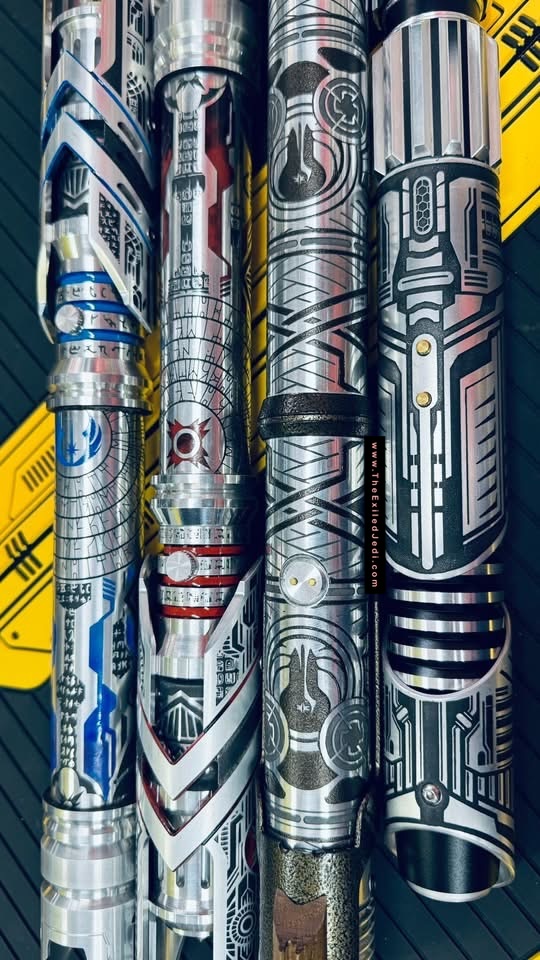 L-R or B-T:
the Serenity etched by Nick Greenland Ng sabers: https://theexiledjedi.com/saber/69c41cbf14381850558b9ba1
Shadowcrest wooden Templar: https://theexiledjedi.com/saber/69c41cbf14381850558b9b6b
The pair of Valkyries from Vaults of Valhalla in Sith/Jedi style:
https://theexiledjedi.com/saber/69e44064767e8ab3b10c3e52
https://theexiledjedi.com/saber/69cd524a64b46ff4fc25ec48
(Feb2026)