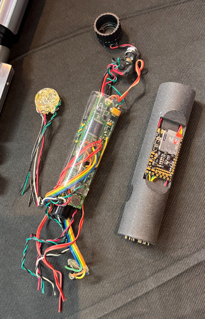 Left: a bare-wired early install using foam/tubing. Right: a modern resin chassis.