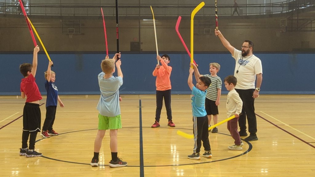 Kids playing floor hockey