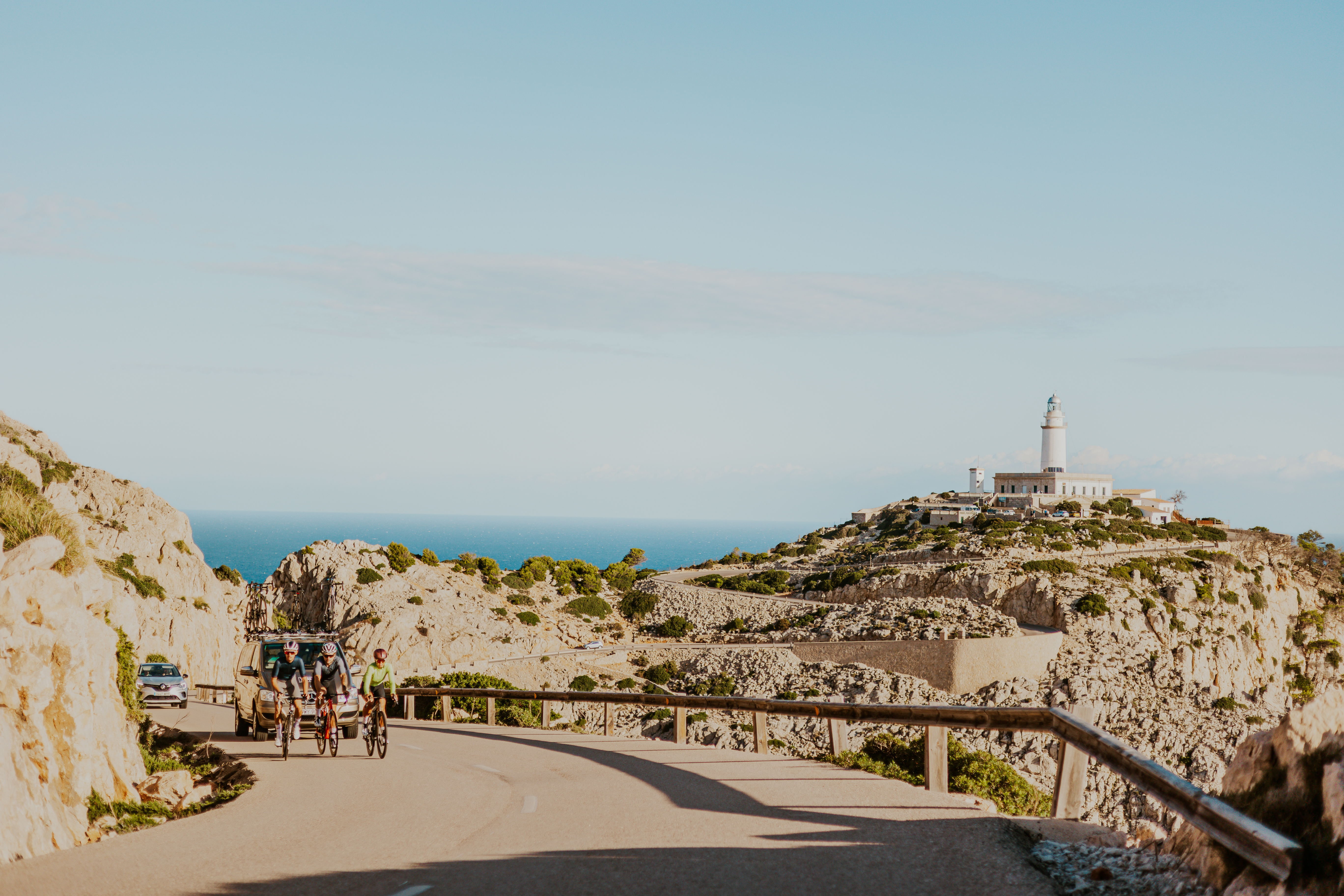 TEMPO cyclists riding towards Cap de Formentor lighthouse in Mallorca