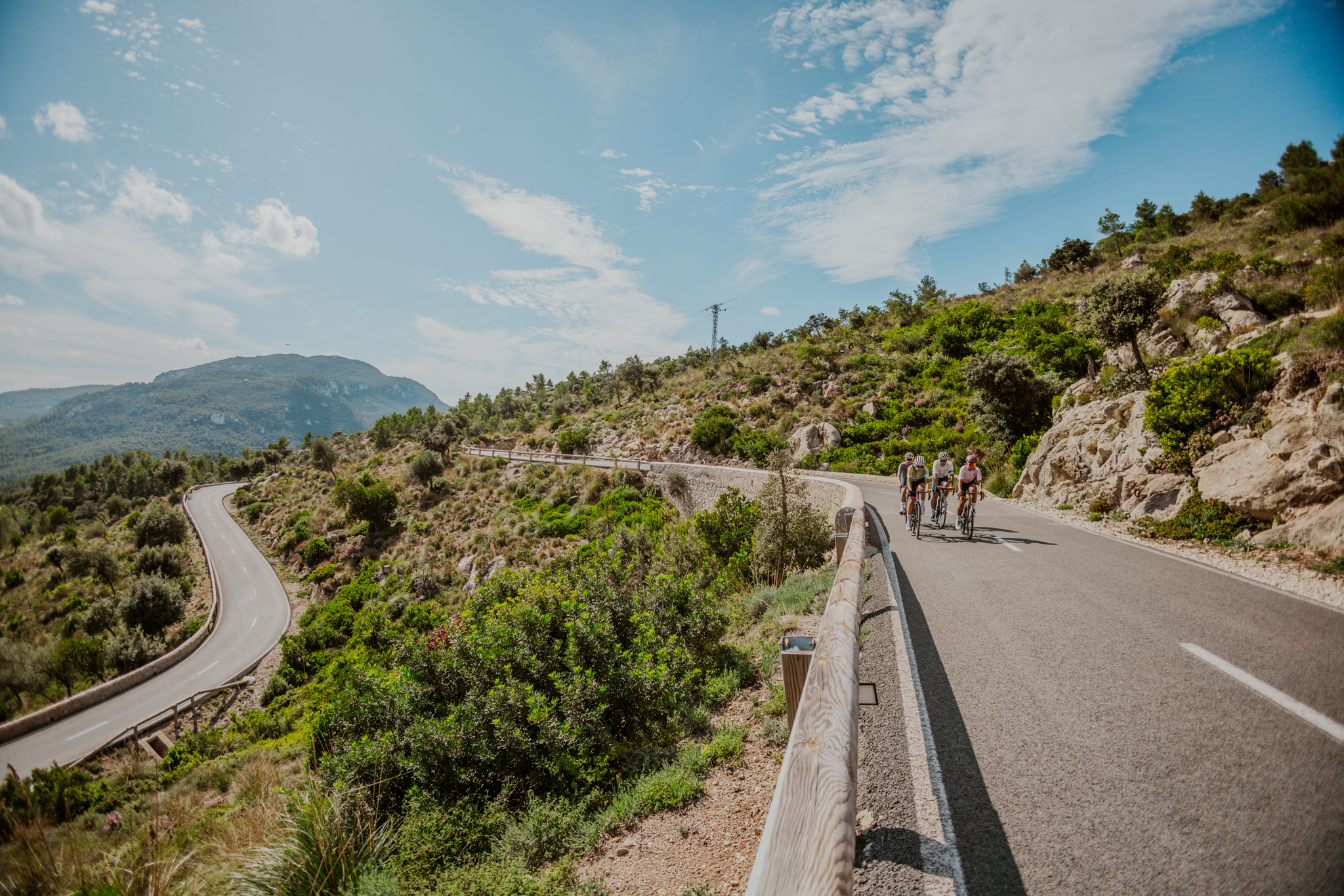 Group of cyclists riding a mountain road in Mallorca