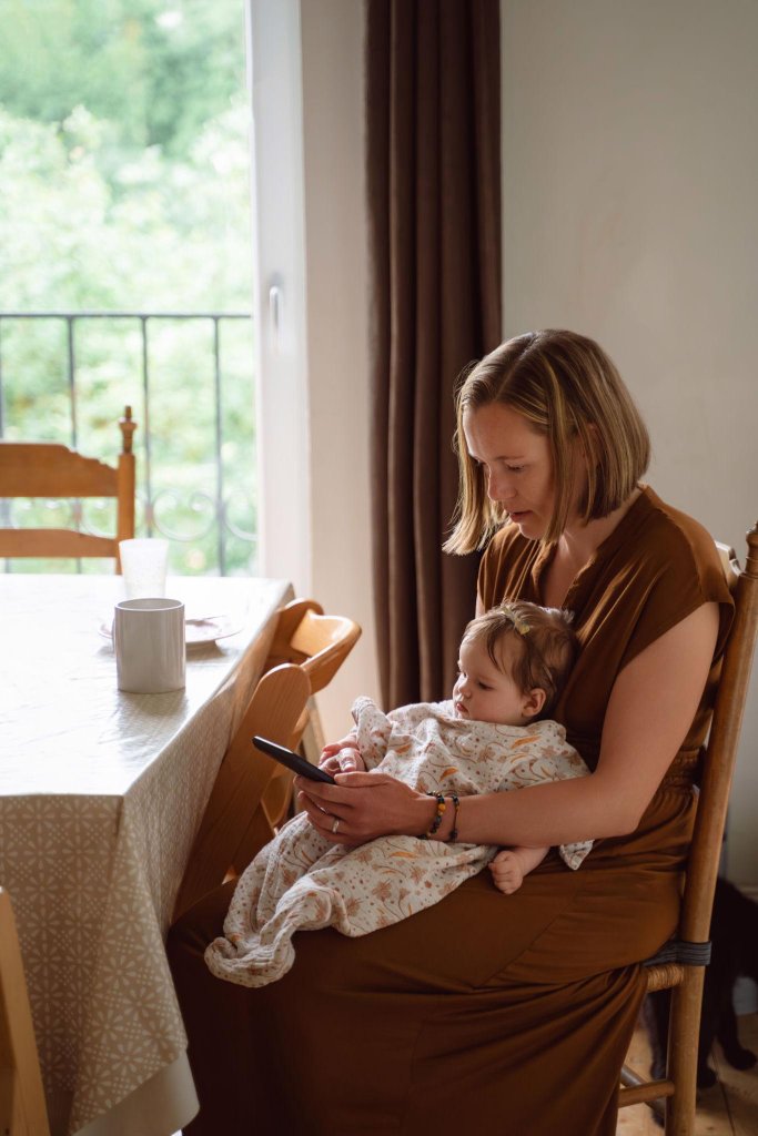 Mother sitting with baby