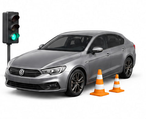 Car with traffic light and cones