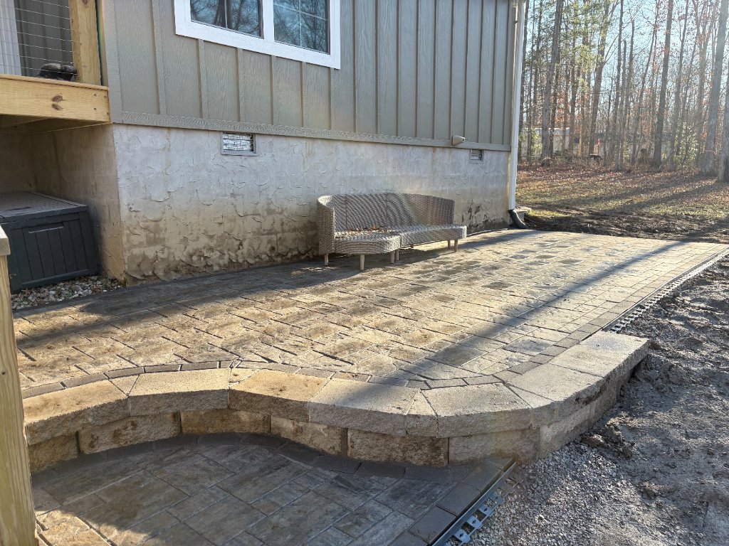 Raised paver patio with retaining wall seating