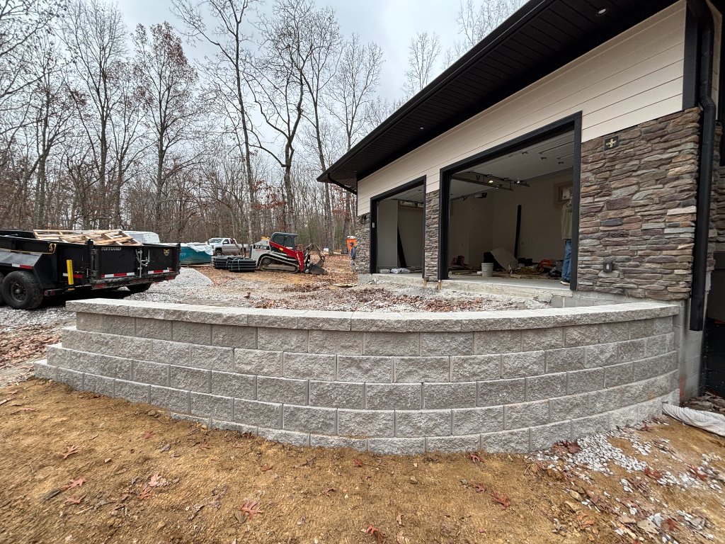 Curved concrete block retaining wall at new construction