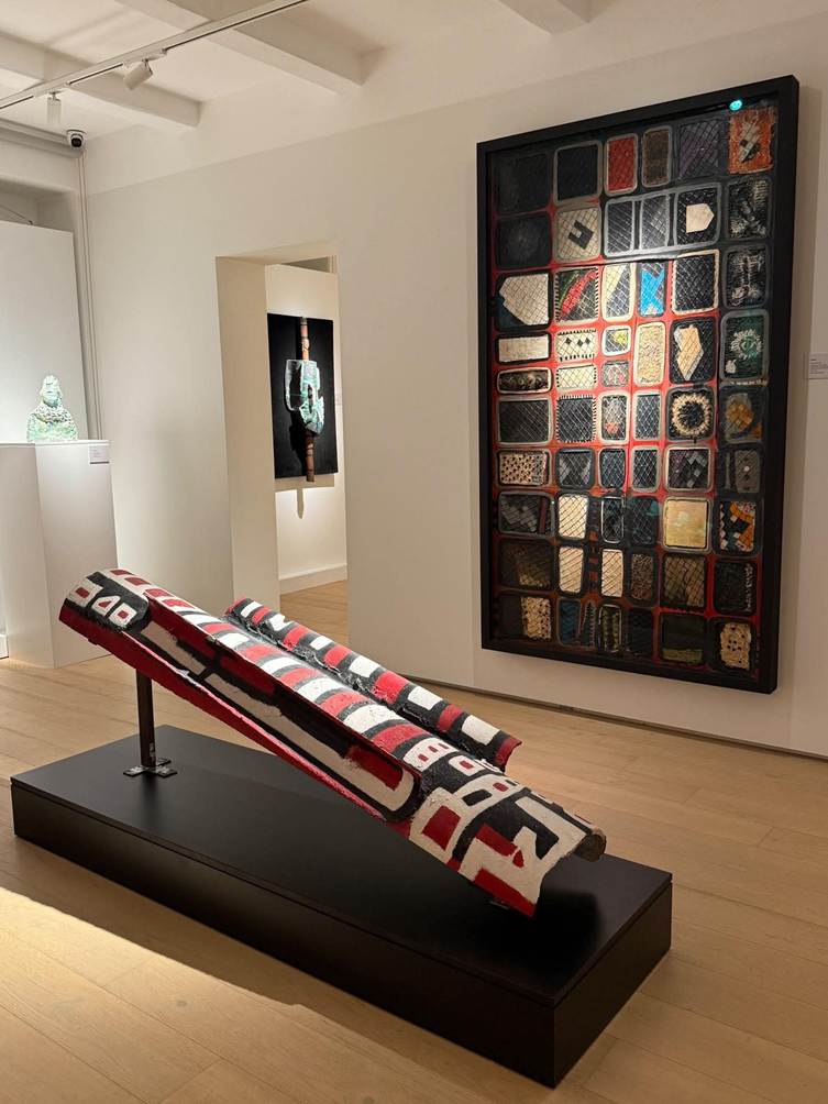 Installation view — painted cylindrical sculpture and grid relief at the Victor Passmore Gallery