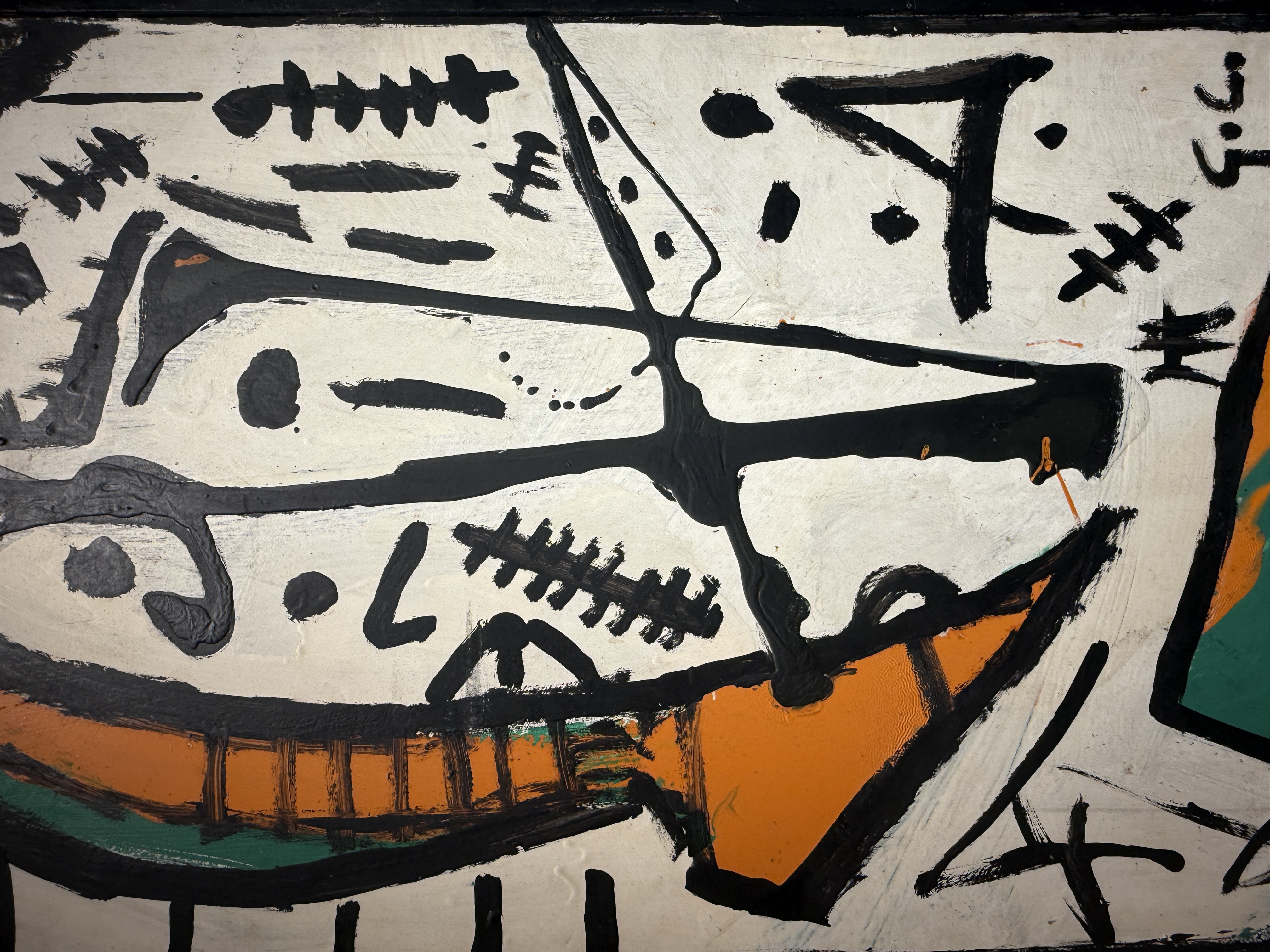 Abstract painting by Gabriel Caruana with bold black calligraphic strokes on off-white background with orange and teal accents at the Victor Passmore Gallery