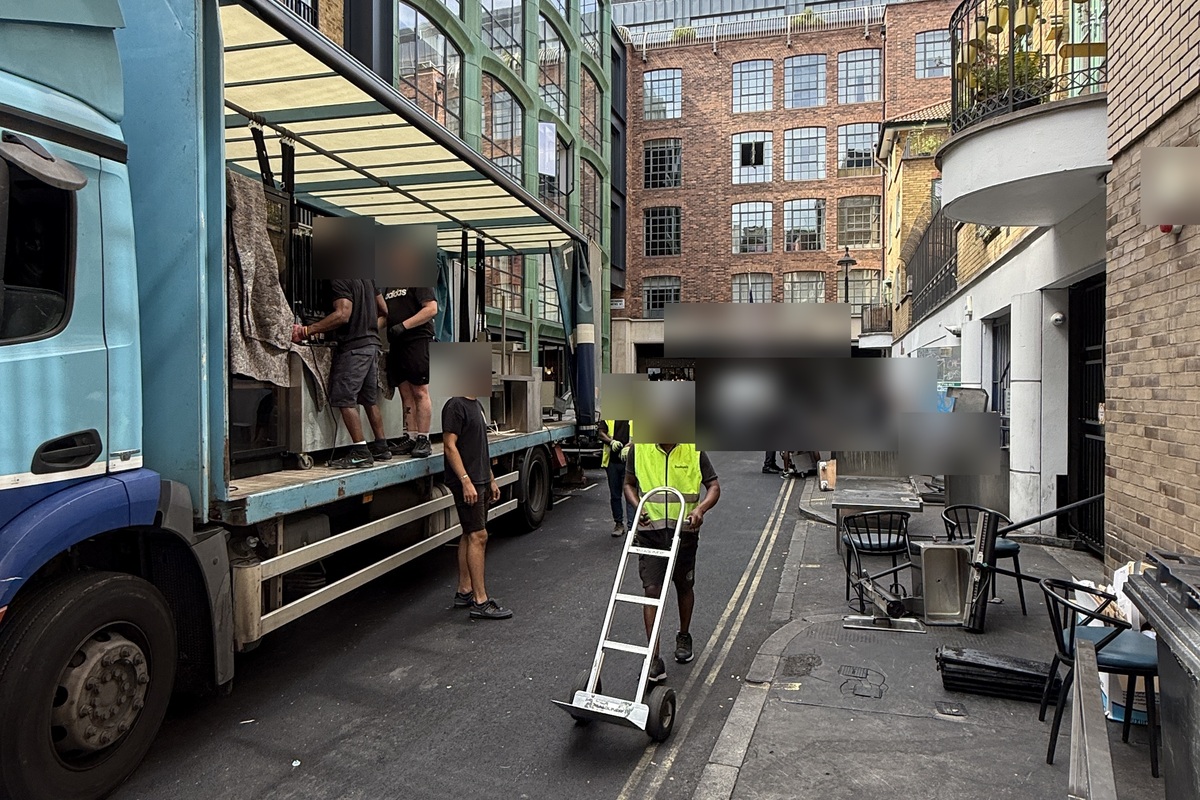 Redeploy team loading kitchen and bar equipment onto a lorry during a restaurant clearance