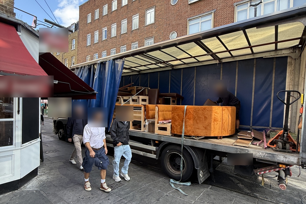 Booth seating from a restaurant clearance loaded onto an 18-tonne lorry for delivery to a buyer