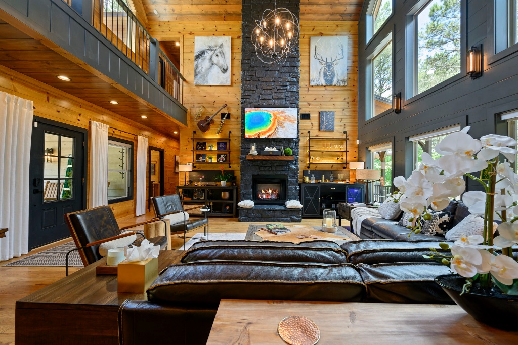 Living Room - Stone Fireplace & High Ceilings