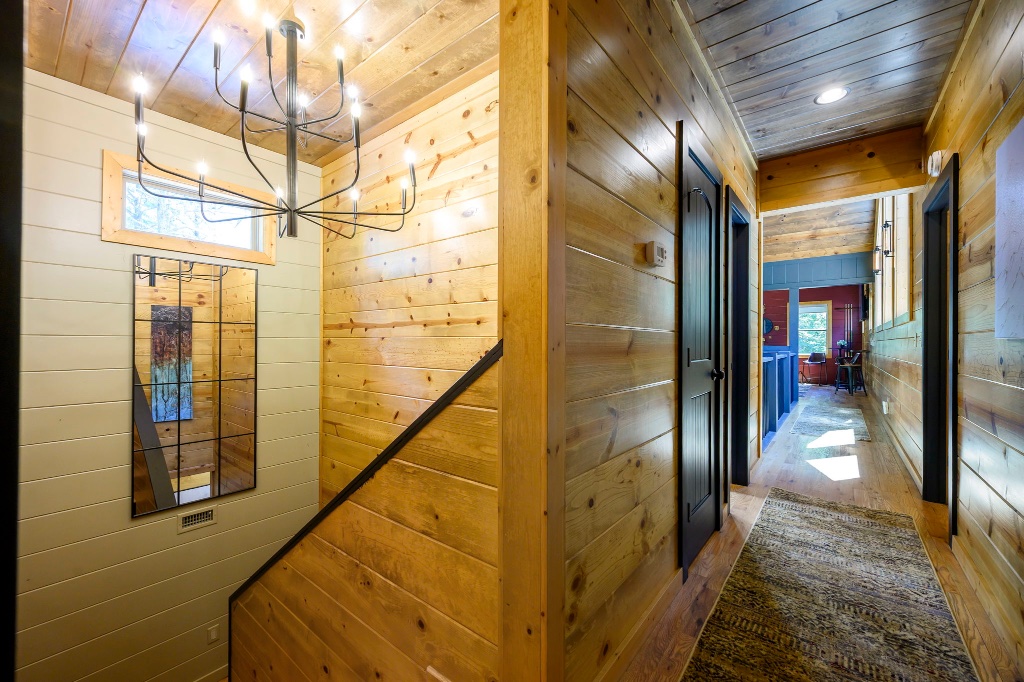 Hallway - Wood Paneled Walls & Chandelier