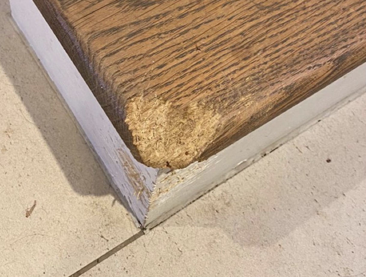 Damaged wooden edge before repair