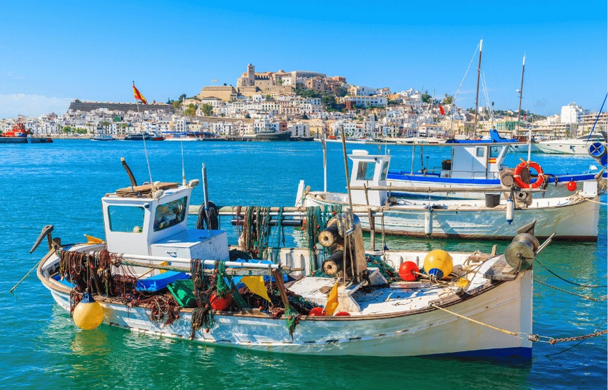 Ibiza harbor with fishing boats and Dalt Vila old town